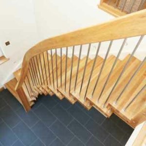 looking down on an oak staircase with stainless spindles