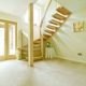 hallway with floating half turn wooden staircase