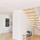white handrail and spindles on a light open floating stair with timber floor