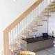 straight flight light wood open staircase with white wall stringer