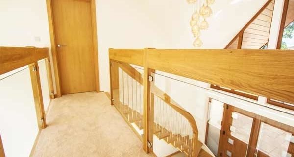 carpeted walkway with glass balustrade to both sides