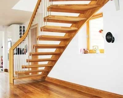 oak floor with a floating oak staircase above