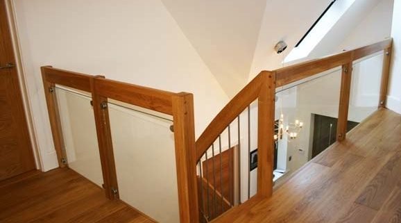 landing balustrade with glass panels around a stairwell