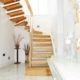 light tiled floor with oak open staircase in a half turn staircase