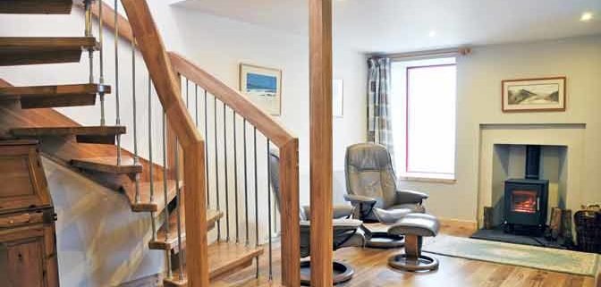 floating oak staircase in a living room