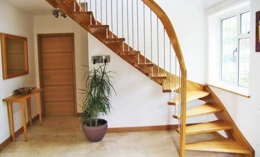 quarter turn oak staircase with tiled floor below