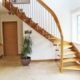 quarter turn oak staircase with tiled floor below