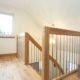 landing balustrade with oak handrail and stainless steel spindles