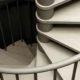 looking down on the light wooden steps of the C20 spiral staircase