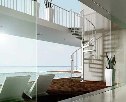 looking through window to the sea with outside spiral staircase rising to walkway