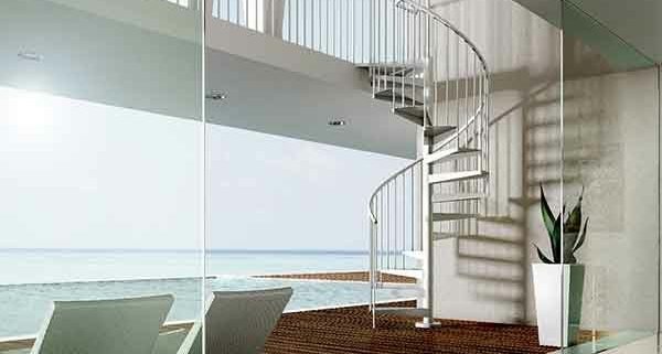 looking through window to the sea with outside spiral staircase rising to walkway