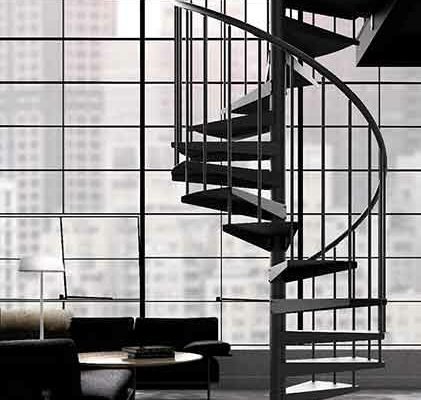 slimline black spiral staircase in from of a huge crittall window