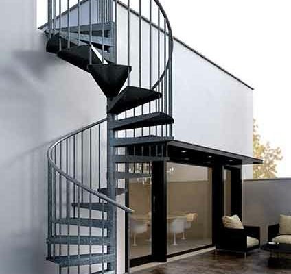 galvanised spiral stair running up the side of a domestic property