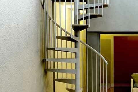 external spiral stair in corner of courtyard