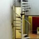external spiral stair in corner of courtyard