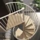 looking down on top triangular platform of the phola spiral stair in light wood