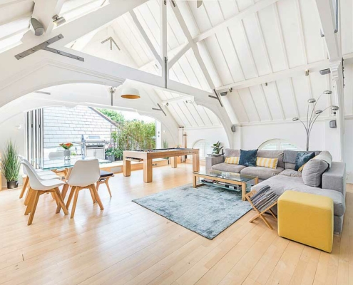 Light airy living area with larger vaulted ceiling.