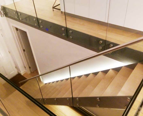 aerial view of stair with frameless glass balustrade and timber treads