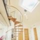 oak step spiral with curved glass. Large roof window above