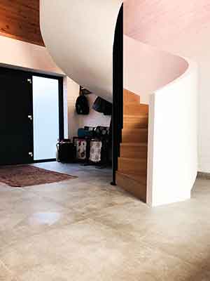 white spiral stair with closed oak treads