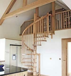 all oak spiral stair with oak beams above