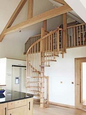 all oak spiral stair with oak beams above