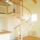 spiral stair in an apartment rising to a mezzanine