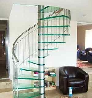 sitting room with sofa and chairs and a glass spiral stair
