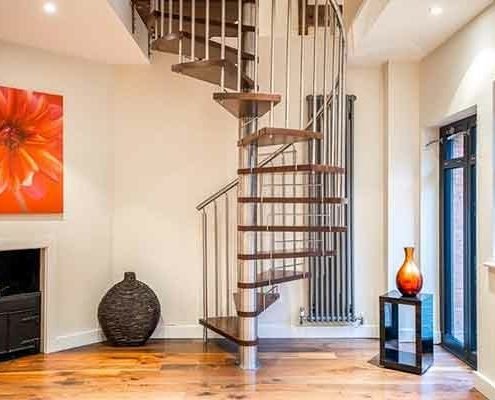 walnut and stainless steel spiral in a house with red flower picture