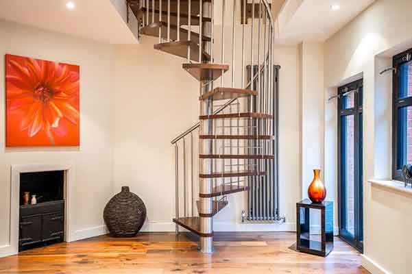 walnut and stainless steel spiral in a house with red flower picture