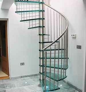 white wall living area with a glass spiral staircase