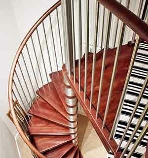 view from above of a spiral stair in a house with wooden steps