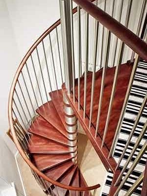 view from above of a spiral stair in a house with wooden steps