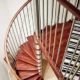 view from above of a spiral stair in a house with wooden steps