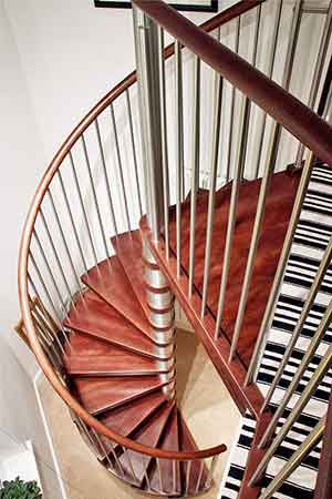 view from above of a spiral stair in a house with wooden steps