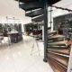 curved spiral stair with dark wood steps and curved glass