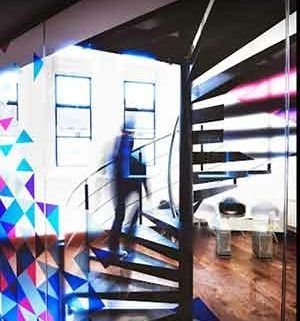 colouerful design to front and metal spiral stair to rear and larger window behind