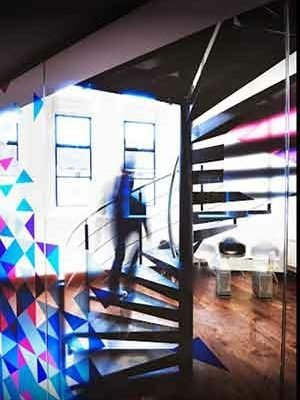 colouerful design to front and metal spiral stair to rear and larger window behind