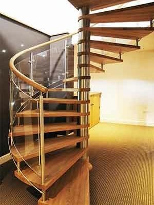 spiral stair set in a room with sparkly black wall behind