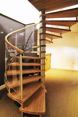 spiral stair set in a room with sparkly black wall behind