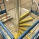 industrial setting with spiral staircase and steel floors
