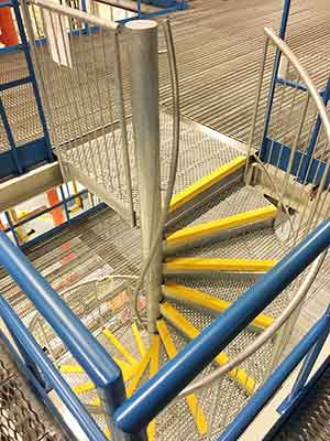 industrial setting with spiral staircase and steel floors