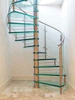 white walls on three sides and a glass spiral stair in the middle