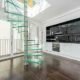 kitchen with large window behind, Glass spiral stair in front