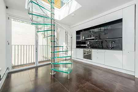 kitchen with large window behind, Glass spiral stair in front