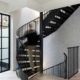 black spiral stair with man walking up