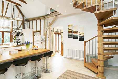 period building featuring an oak spiral and a kitchen