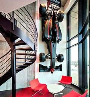 racing car attached to wall and steel spiral in fore ground