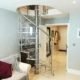 transparent spiral stair in a living room setting with sofa