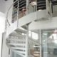 showroom setting with a white spiral stair rising